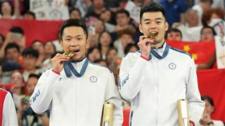 羽球選手李洋、王齊麟「麟洋配」在奧運拿下金牌，成功二連霸。（圖／中華奧會提供）